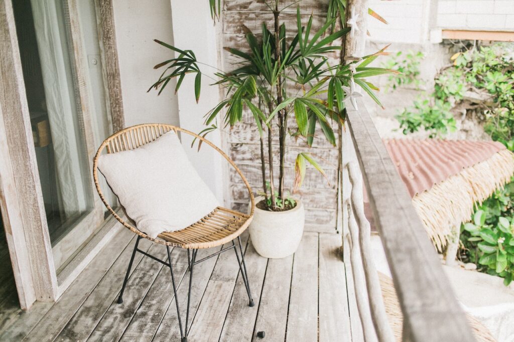 Living in Costa Rica image of a deck with a tropical plant and chair